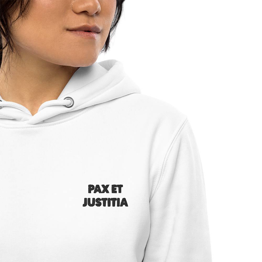 White minimalist hoodie. Close-up of a black embroidered motto "Pax et Justitia" on the left front.