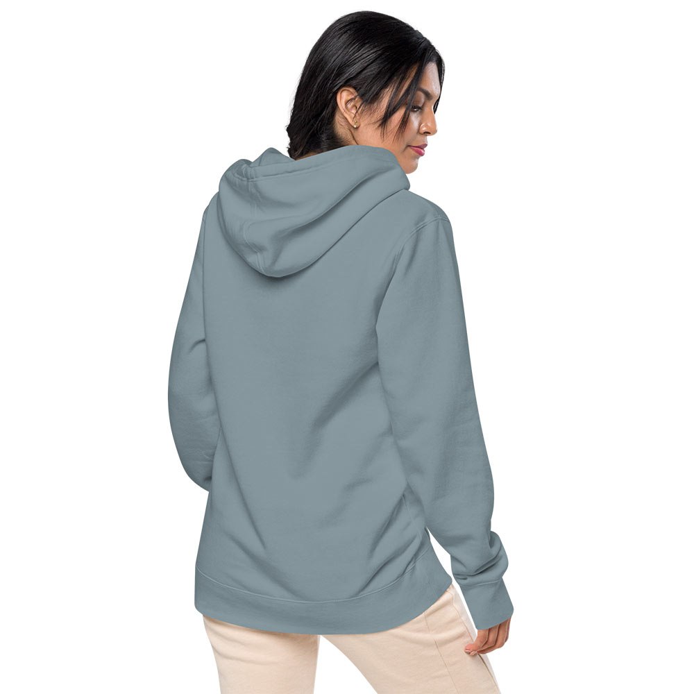 Unisex Vintage Wash Hoodie in Muted Blue "Pacem in Terris". Back view of the hoodie on a female model.