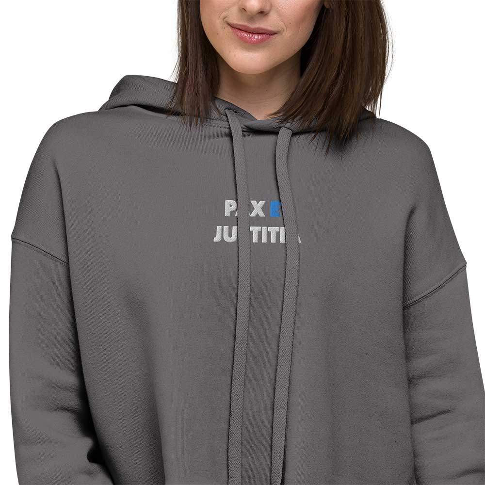 Ultra Soft Cropped Hoodie. Close-up of a white and blue embroidered motto "Pax et Justitia" on the center chest.